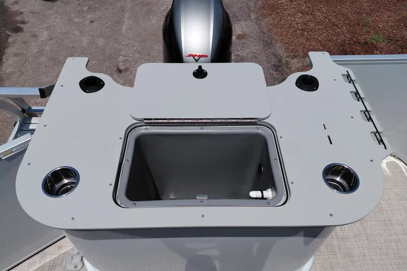 Slide: The Image of 2022 SunCatcher Select 20F boat console with storage compartment and cup holders. - 31