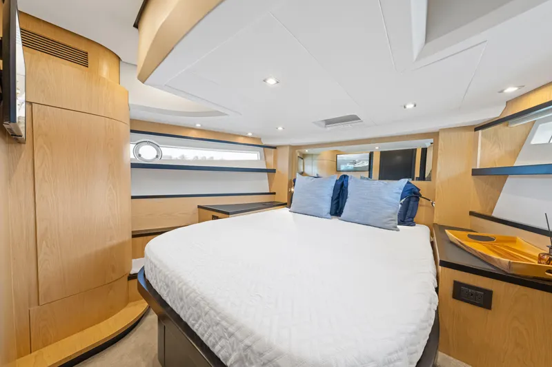 Slide: The Image of Luxurious 2025 OKEAN 52 yacht bedroom with modern design and cozy bedding. - 54