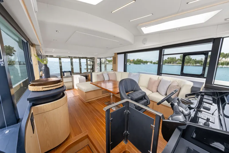 Slide: The Image of Luxurious interior of 2025 OKEAN 52 yacht with modern furnishings and panoramic windows. - 44