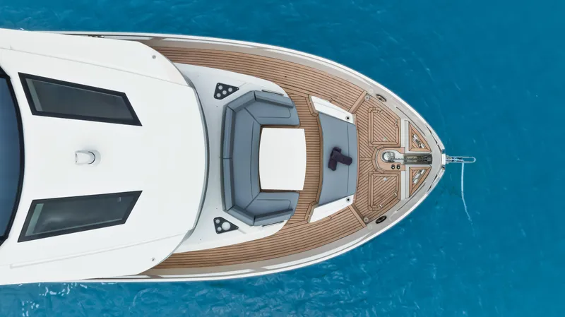 Slide: The Image of Aerial view of 2025 OKEAN 52 yacht on clear blue water. - 34