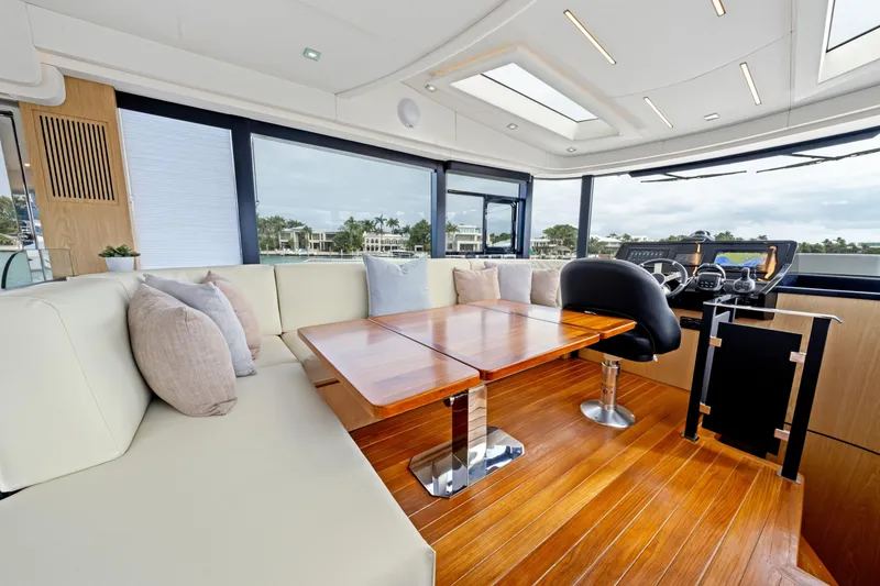 Slide: The Image of Luxurious interior of 2025 OKEAN 52 yacht with modern seating and wooden flooring. - 42