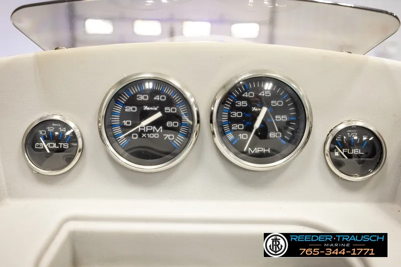 Slide: The Image of Dashboard of a 2003 Fisher 220 FISH boat with gauges for volts, RPM, speed, and fuel. - 25