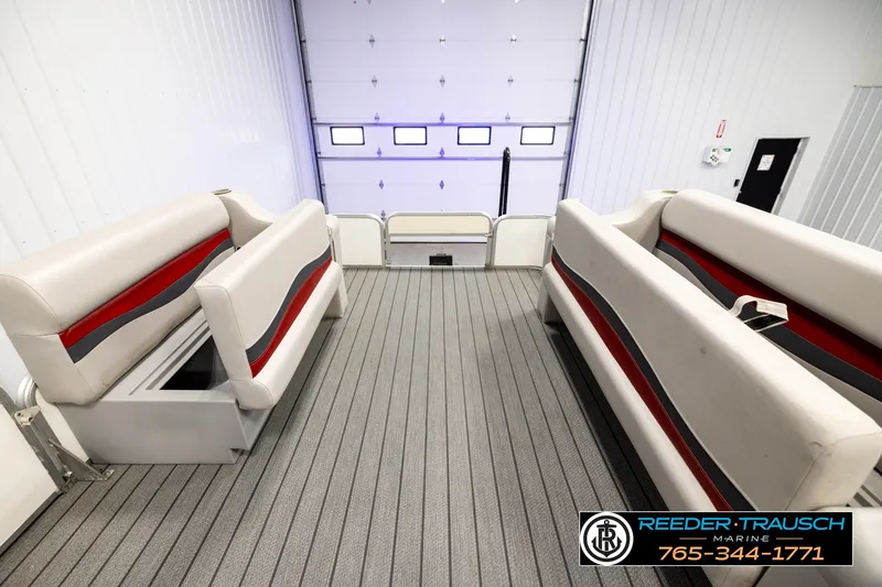 Slide: The Image of Interior view of 2003 Fisher 220 FISH boat with seating and storage compartments. - 19