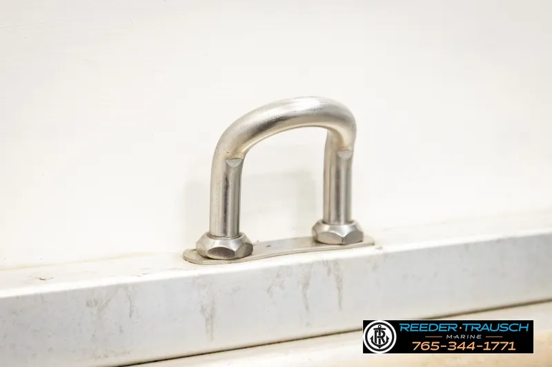 Slide: The Image of Stainless steel boat cleat on a 2003 Fisher 220 FISH, Reeder-Trausch Marine logo visible. - 35