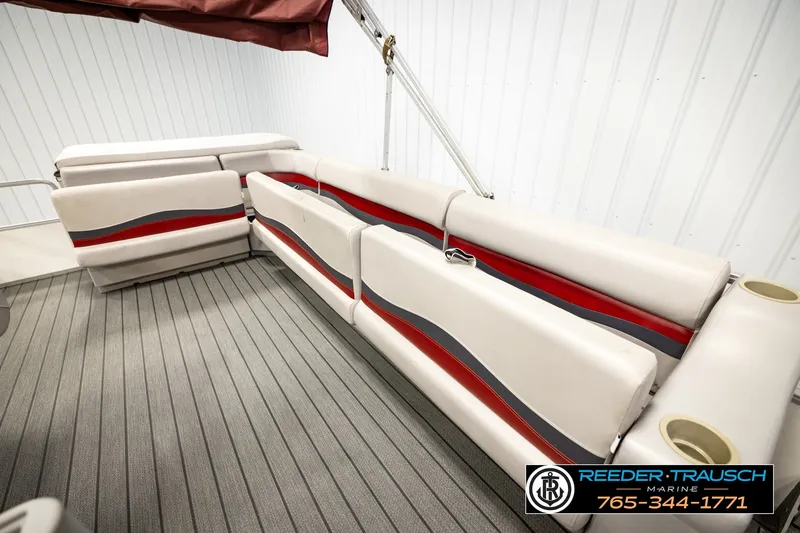 Slide: The Image of 2003 Fisher 220 FISH boat interior with beige and red seating, gray flooring. - 21