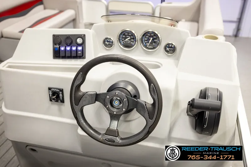 Slide: The Image of Steering console of a 2003 Fisher 220 FISH boat with gauges and controls. - 22
