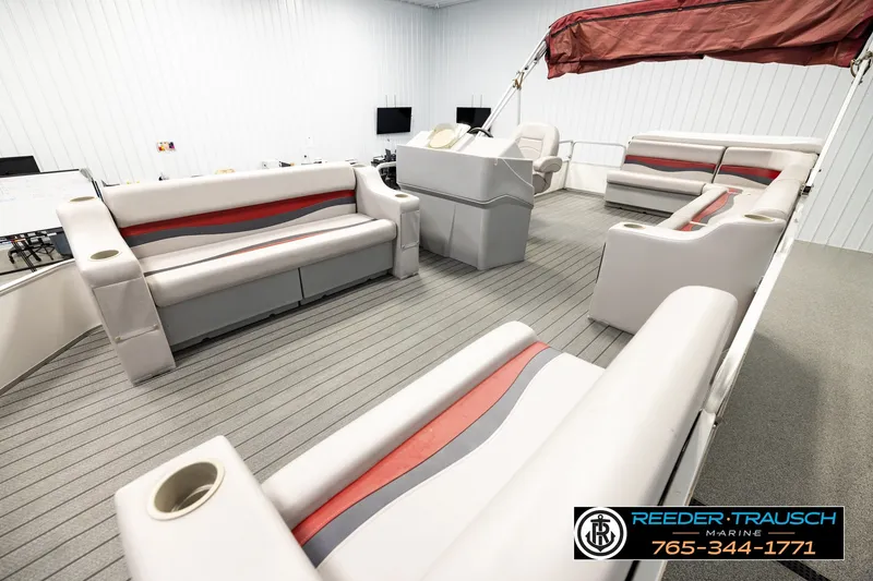 Slide: The Image of Interior of a 2003 Fisher 220 FISH boat with spacious seating and modern design. - 10