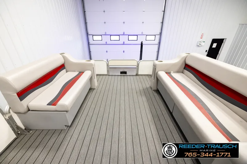 Slide: The Image of Interior of a 2003 Fisher 220 FISH boat with gray and red seating. - 18