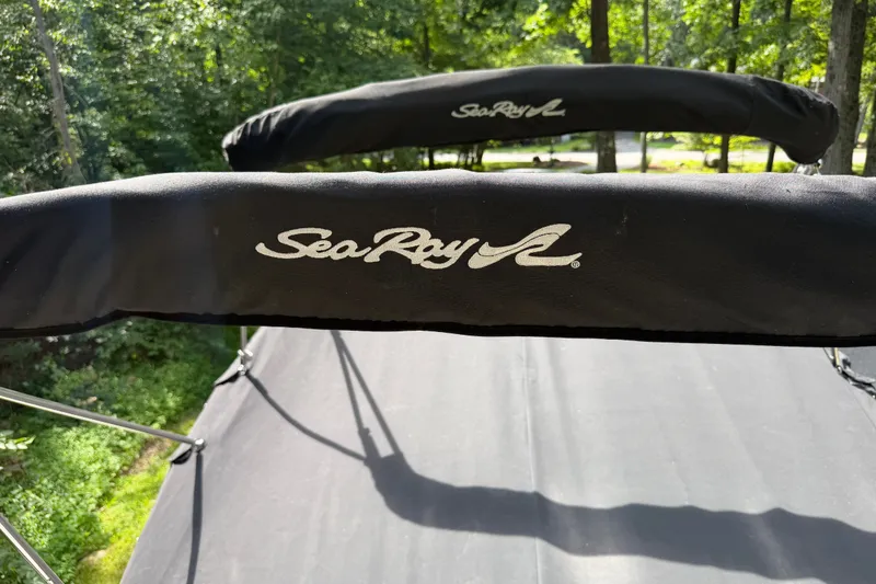 Slide: The Image of Black canopy with Sea Ray logo on a 2016 Sundancer 260 boat. - 72