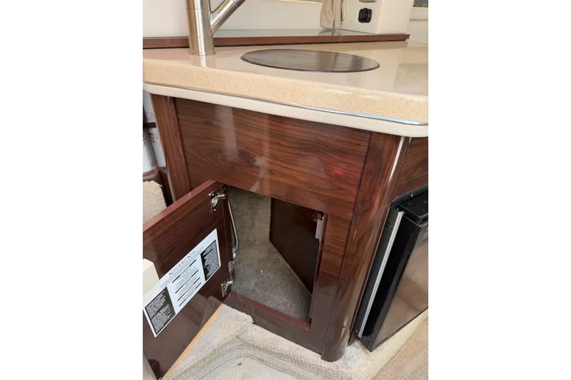 Slide: The Image of 2016 Sea Ray Sundancer 260 interior with open cabinet and countertop. - 57