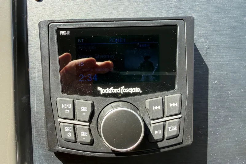 Slide: The Image of Rockford Fosgate audio system on 2016 Sea Ray Sundancer 260 boat, displaying music controls. - 43