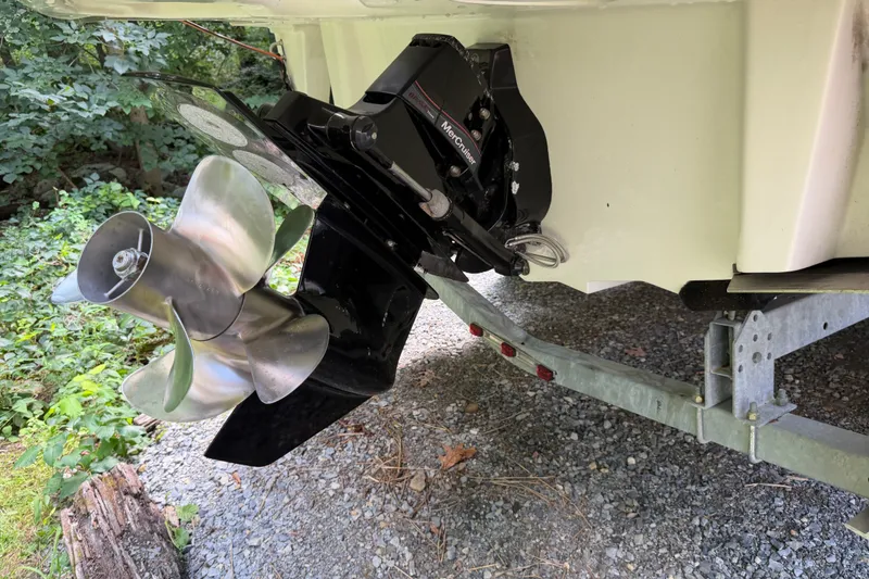 Slide: The Image of 2016 Sea Ray Sundancer 260 boat propeller and outdrive on a trailer. - 65