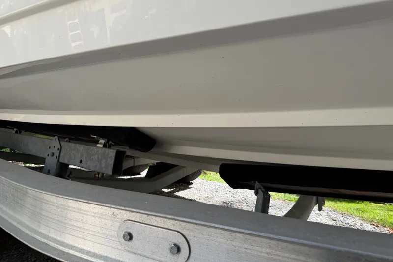 Slide: The Image of 2016 Sea Ray Sundancer 260 boat hull on trailer, close-up view. - 5