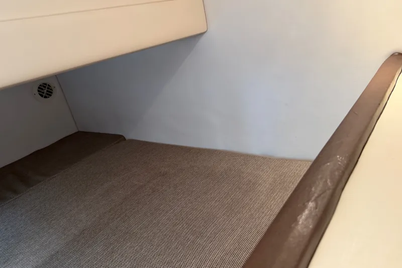 Slide: The Image of Interior cabin of 2016 Sea Ray Sundancer 260 with beige upholstery. - 64