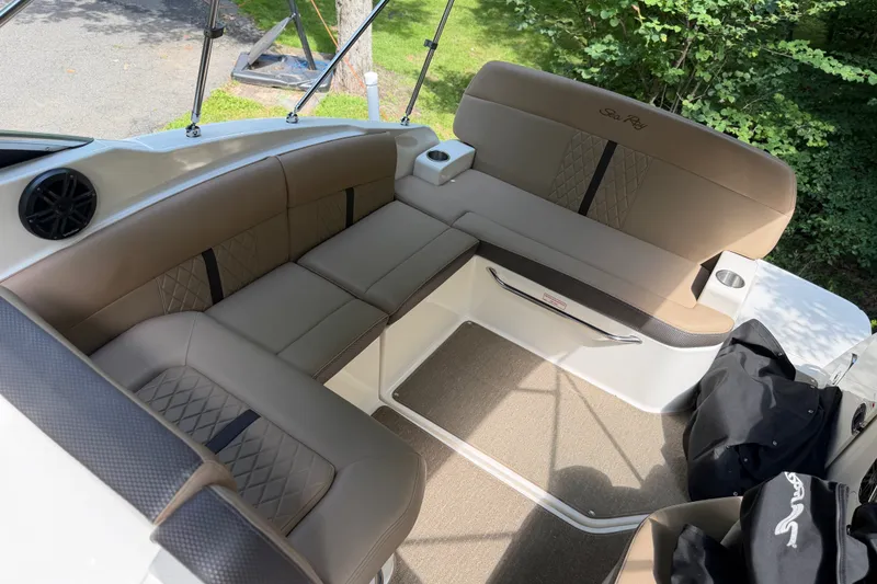 Slide: The Image of 2016 Sea Ray Sundancer 260 interior with beige seating and elegant design. - 31