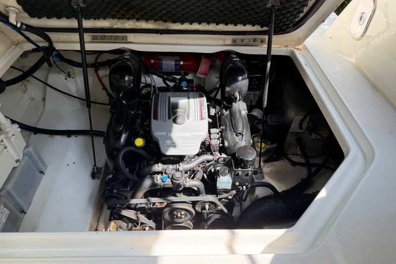 Slide: The Image of Engine compartment of a 2016 Sea Ray Sundancer 260 boat, showcasing the engine and components. - 40
