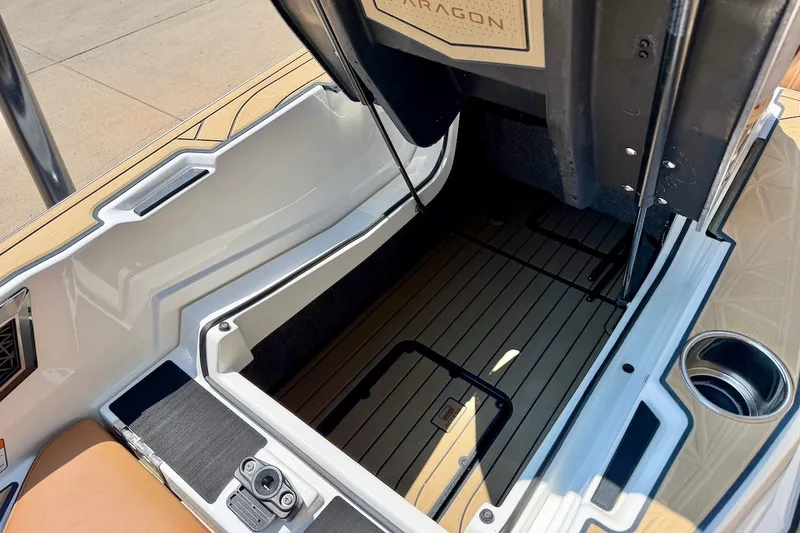 Slide: The Image of 2022 Nautique Super Air Nautique G23 Paragon storage compartment with open hatch. - 24