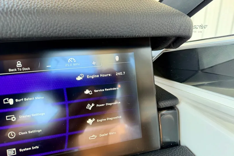 Slide: The Image of 2022 Nautique Super Air Nautique G23 Paragon dashboard displaying engine hours and settings. - 20
