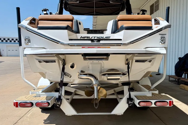 Slide: The Image of 2022 Nautique Super Air Nautique G23 Paragon boat rear view, showcasing sleek design and features. - 5