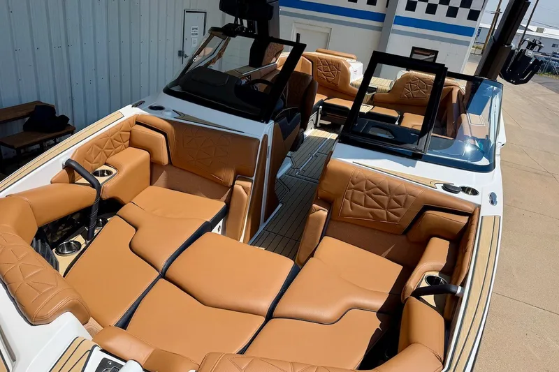 Slide: The Image of 2022 Nautique Super Air Nautique G23 Paragon interior with luxurious tan seating. - 2