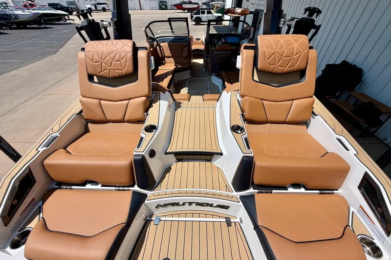 Slide: The Image of 2022 Nautique Super Air Nautique G23 Paragon with luxurious tan seating and sleek design. - 12