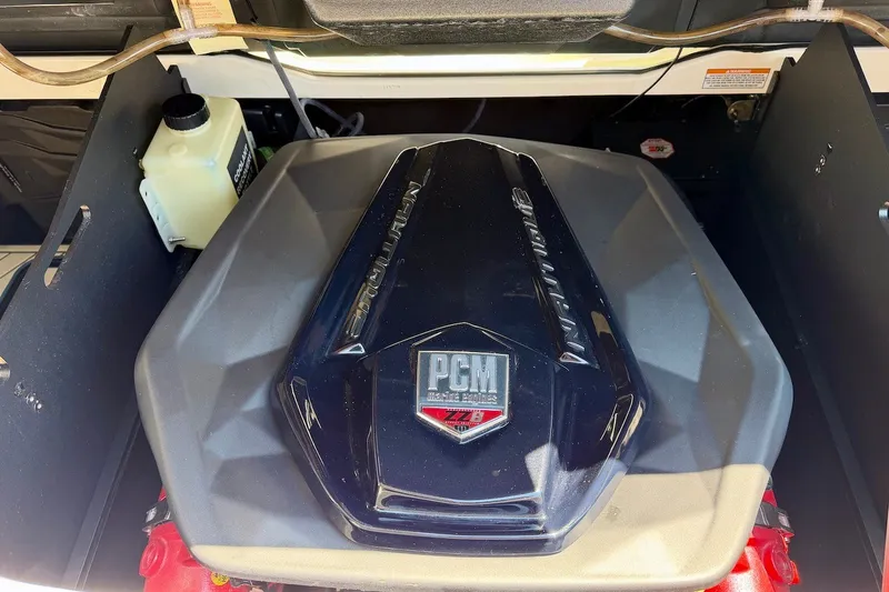 Slide: The Image of Engine compartment of 2022 Nautique Super Air Nautique G23 Paragon with PCM engine cover. - 25