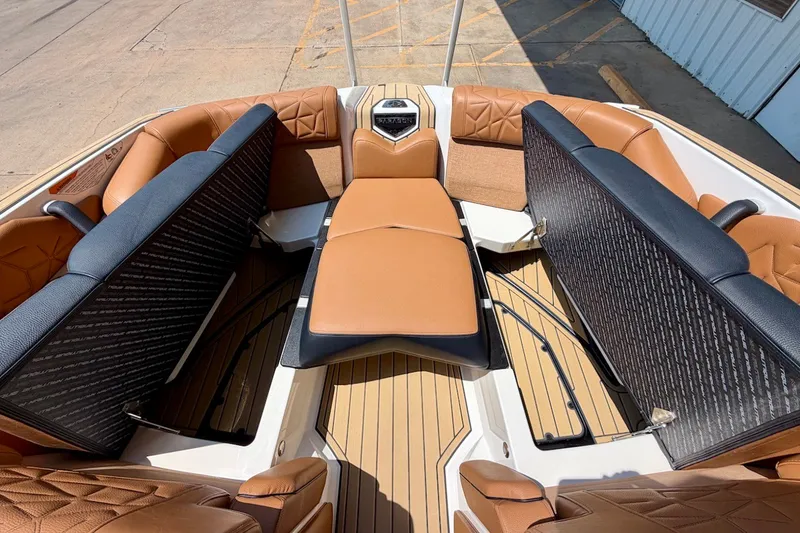 Slide: The Image of Luxurious interior of 2022 Nautique Super Air Nautique G23 Paragon boat with tan seating. - 19