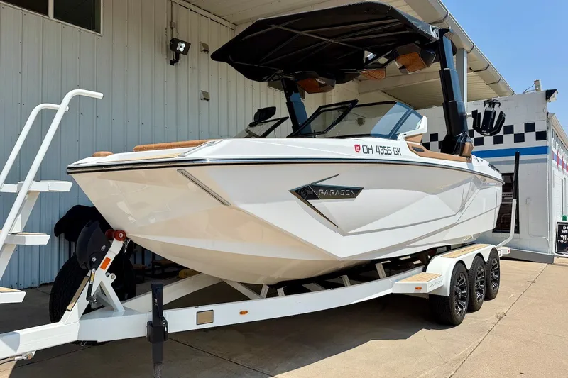 Slide: The Image of 2022 Nautique Super Air Nautique G23 Paragon boat on trailer, parked outdoors. - 3