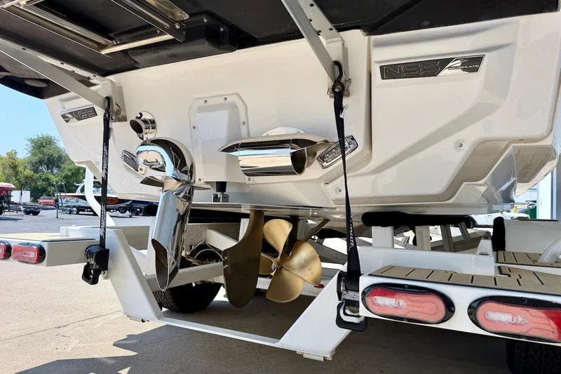 Slide: The Image of 2022 Nautique Super Air Nautique G23 Paragon boat stern with propeller and exhaust system. - 6