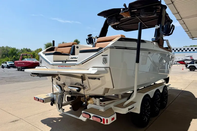 Slide: The Image of 2022 Nautique Super Air Nautique G23 Paragon boat on trailer, rear view. - 7