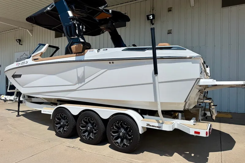 Slide: The Image of 2022 Nautique Super Air Nautique G23 Paragon boat on a trailer, side view. - 4