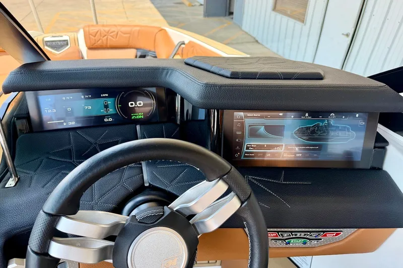 Slide: The Image of 2022 Nautique Super Air Nautique G23 Paragon dashboard with advanced digital displays. - 15