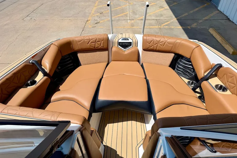 Slide: The Image of Luxurious interior of 2022 Nautique Super Air Nautique G23 Paragon boat with tan seating. - 16