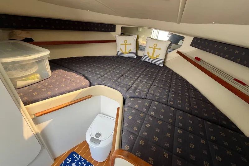 Slide: The Image of Cozy cabin interior of 2001 Tiara Yachts 2900 Coronet with nautical-themed decor. - 27