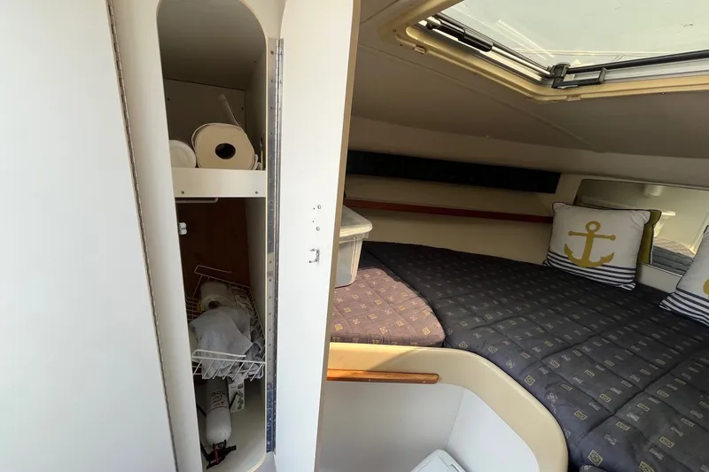 Slide: The Image of Interior cabin of 2001 Tiara Yachts 2900 Coronet with bed and storage. - 29