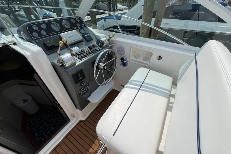 Slide: The Image of 2001 Tiara Yachts 2900 Coronet helm with steering wheel and control panel. - 16