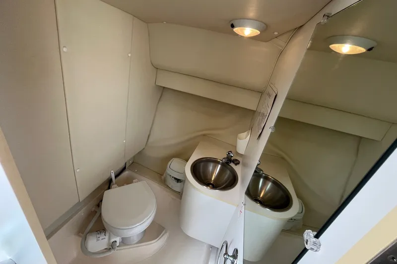 Slide: The Image of 2001 Tiara Yachts 2900 Coronet bathroom with toilet and stainless steel sink. - 30