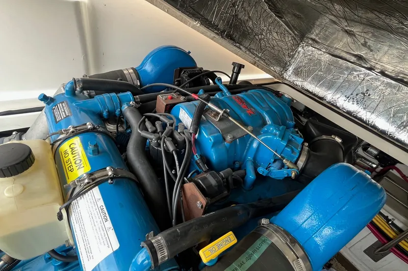 Slide: The Image of Engine compartment of a 2001 Tiara Yachts 2900 Coronet, showcasing blue engine components. - 23
