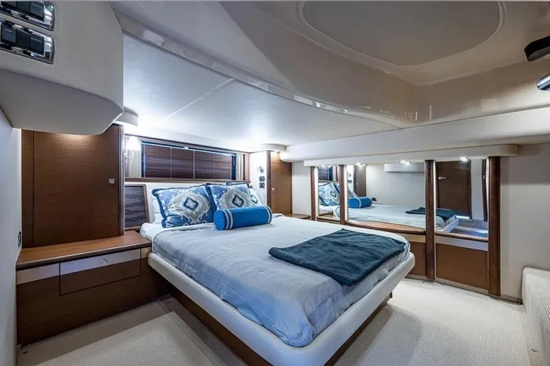 Slide: The Image of Luxurious bedroom interior of 2013 Sea Ray 580 Sedan Bridge yacht with elegant decor. - 10