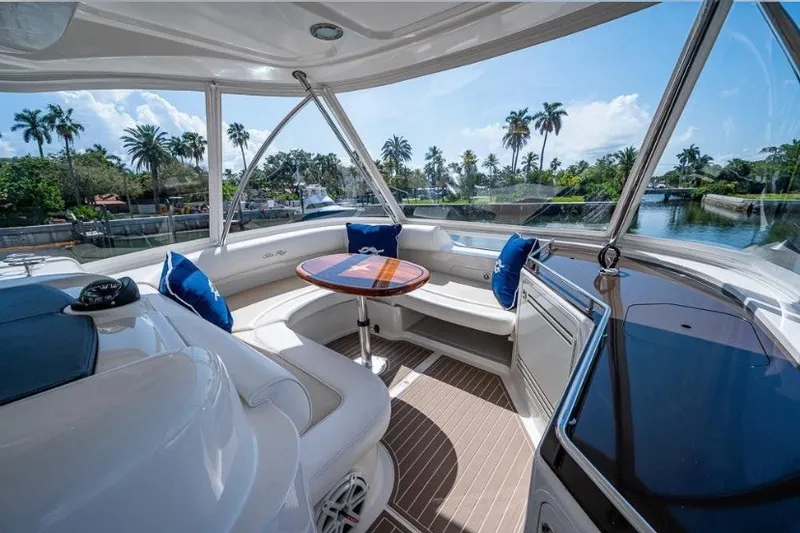 Slide: The Image of Luxurious 2013 Sea Ray 580 Sedan Bridge interior with scenic waterfront view. - 5
