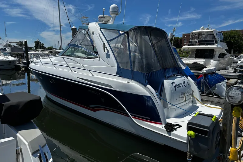 The Image of 2007 Formula 34 Performance Cruiser docked at marina under clear blue sky. - 0