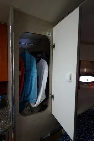 Slide: The Image of 2007 Formula 34 PC interior closet with hanging clothes. - 26