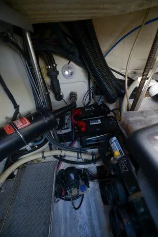 Slide: The Image of Engine compartment of a 2007 Formula 34 PC boat, showing batteries and wiring. - 35