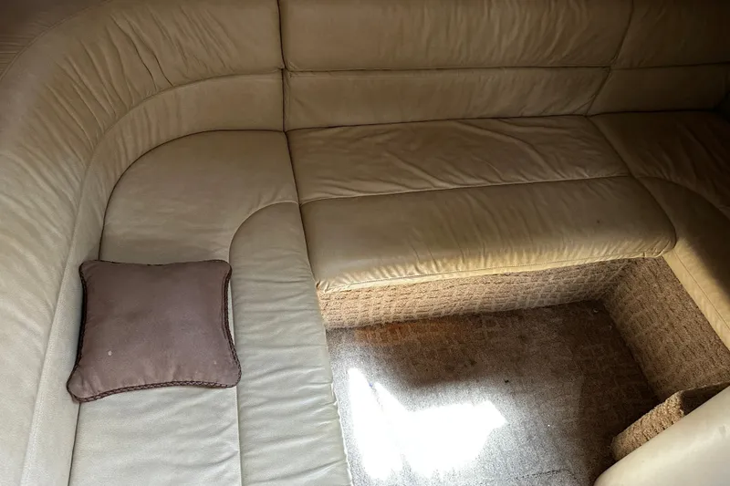 Slide: The Image of Interior of a 2007 Formula 34 Performance Cruiser with beige leather seating and a brown cushion. - 20