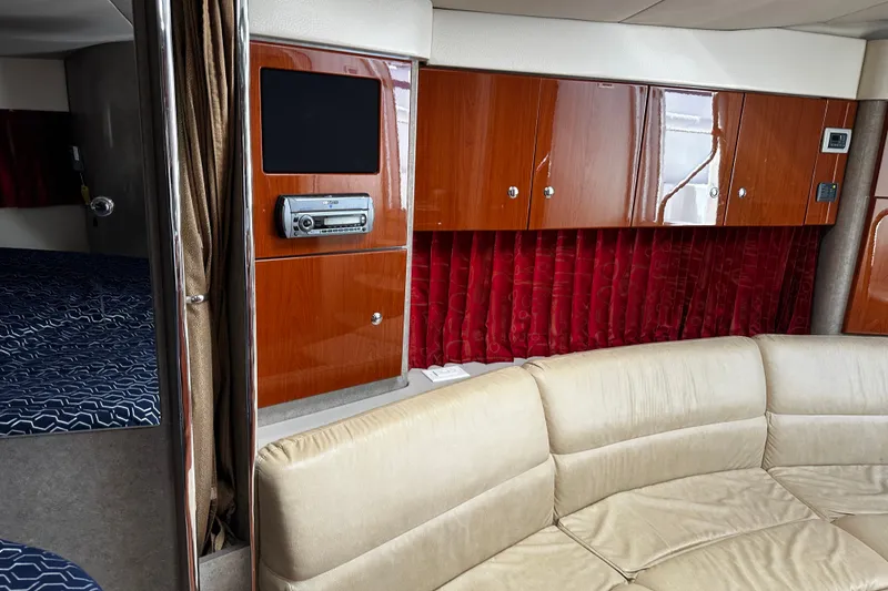 Slide: The Image of Interior of 2007 Formula 34 Performance Cruiser with beige seating and wood cabinetry. - 21