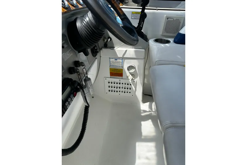 Slide: The Image of 2007 Formula 34 Performance Cruiser cockpit interior with steering wheel and control panel. - 17