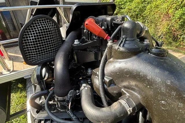 Slide: The Image of 2023 Crest Classic DLX 220 engine close-up, showcasing intricate mechanical components. - 27