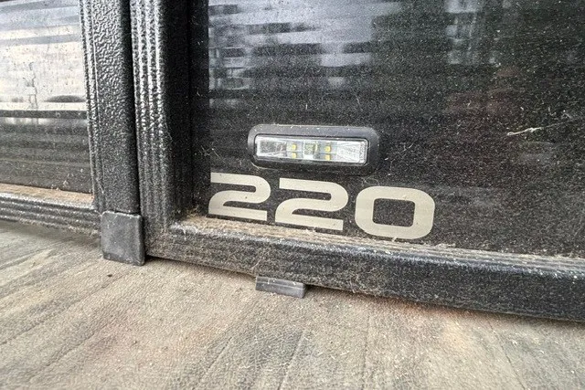 Slide: The Image of 2023 Crest Classic DLX 220 boat detail with LED light and model number. - 16