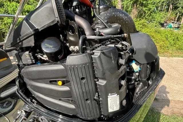 Slide: The Image of 2023 Crest Classic DLX 220 engine close-up, showcasing intricate mechanical components. - 26