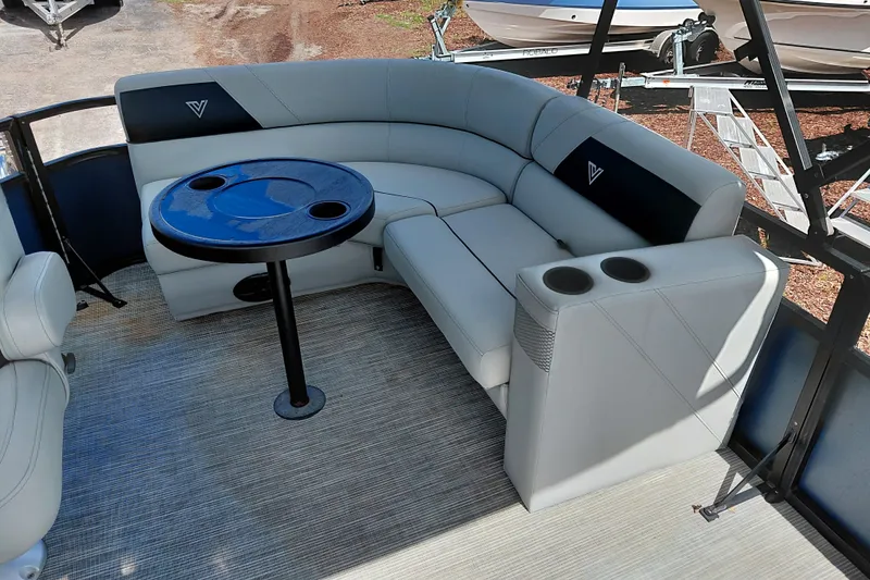 Slide: The Image of Luxurious seating area on 2023 Viaggio Del Mar C boat with table and cup holders. - 26